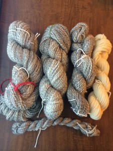 The colored cotton helps me differentiate the three large skeins.  The red skein is the 418 yards, the green skein is the 510 yards, and the white skein is the 300 yards.